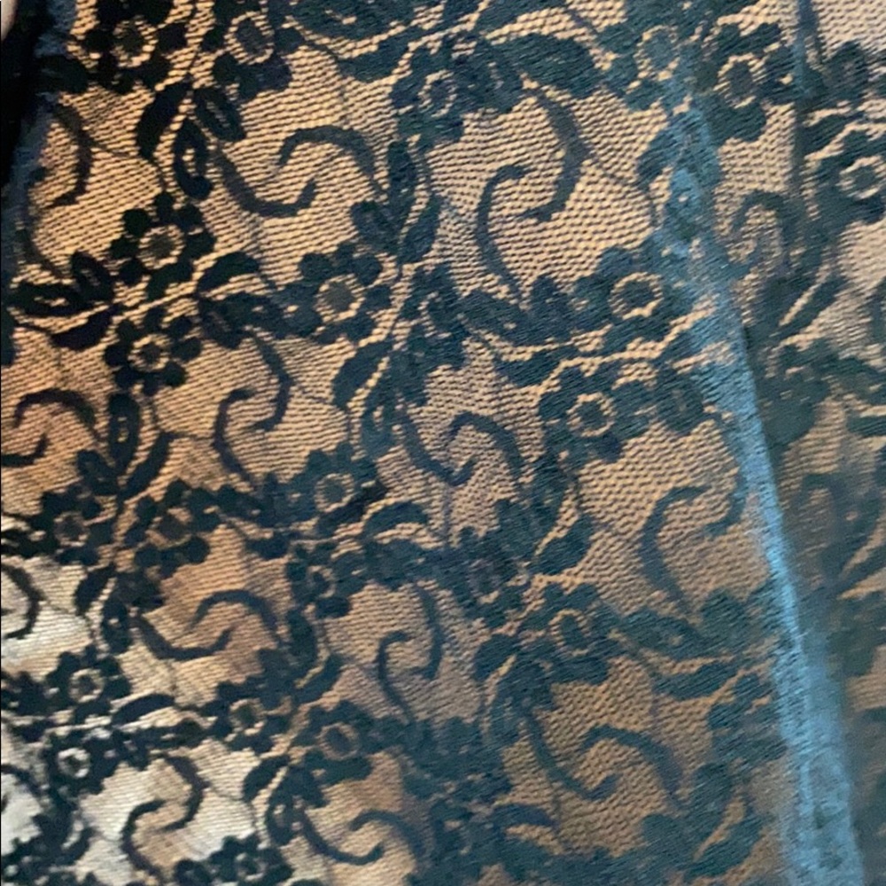 Very large piece of stretchy black lace fabric